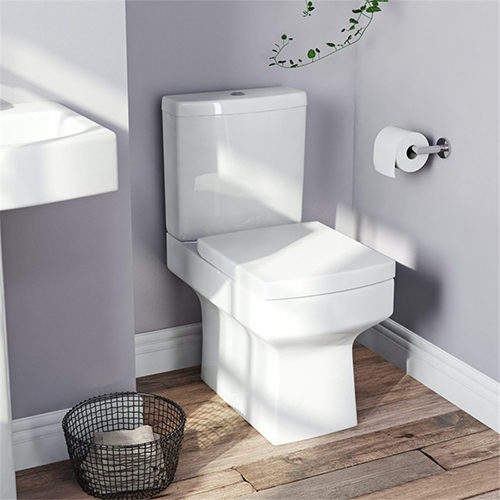 Close coupled floor standing sanitary toilet